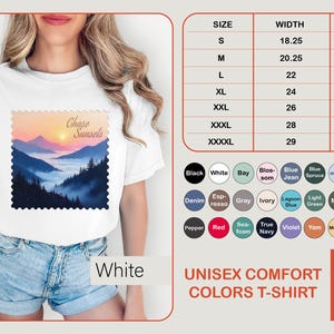 May include: White unisex comfort colors t-shirt with a mountain sunset graphic. The shirt has a crew neck and short sleeves. Size chart shows widths from 18.25 to 29 inches and lengths from 26.6 to 33.5 inches.