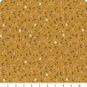 May include: A mustard yellow fabric with a repeating pattern of delicate white flowers and pink berries on winding brown vines.