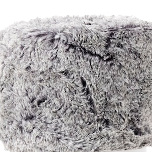 May include: A gray fluffy ottoman with a soft, plush texture. The ottoman is round and has a smooth, even surface.