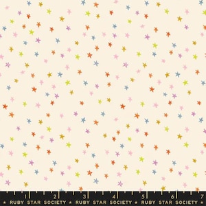 May include: A white fabric with a repeating pattern of colorful stars. The stars are in various shades of pink, orange, yellow, and blue. The fabric is perfect for quilting, sewing, and crafting.