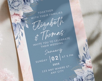 May include: A rectangular wedding invitation card featuring a dusty blue central panel with white text reading Together with their families, Elizabeth & Thomas, invite you to celebrate their wedding, Sunday January 02 2025 at 5 PM, 123 Any Where St., Any City, framed by watercolor floral illustrations in shades of blue, pink, and gold.