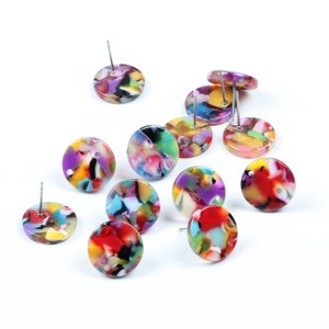 May include: Assortment of colorful round earrings with a marbled pattern. Each earring has a silver post.