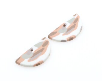 May include: Two half-circle shaped polymer clay earrings with a white base and a brown and gray abstract pattern.