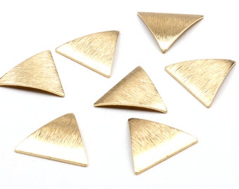 May include: Seven gold-toned triangle-shaped metal embellishments with a brushed finish.