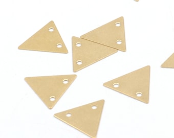 May include: A group of ten gold triangle-shaped metal charms with two holes each. The charms are scattered on a white surface.