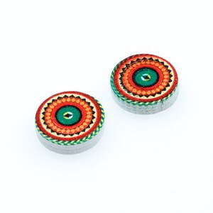 May include: A pair of round, wooden earrings with a colorful mandala design. The earrings are red, orange, yellow, green, and blue.