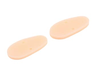 May include: Two beige silicone earplugs with two small holes in each.