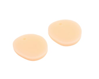 May include: Two beige silicone earplugs with a small hole in the center of each.
