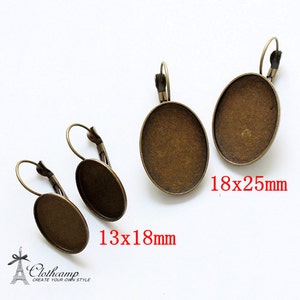 May include: Three pairs of oval-shaped earring blanks with a bronze finish. The earring blanks are 13x18mm and 18x25mm.