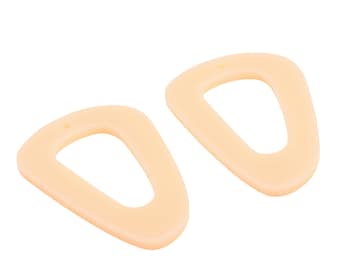 May include: A pair of cream-colored, geometric shaped earrings. The earrings are made of a smooth, matte material and have a simple, modern design.