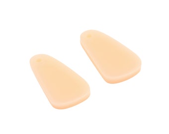 May include: Two peach-colored, teardrop-shaped resin earrings with a small hole at the top for hanging.