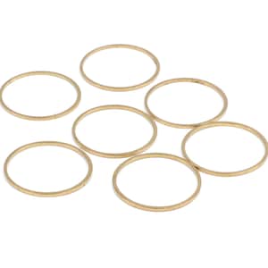 May include: Six gold-colored metal rings, each with a smooth, rounded surface. The rings are arranged in a semi-circle on a white background.