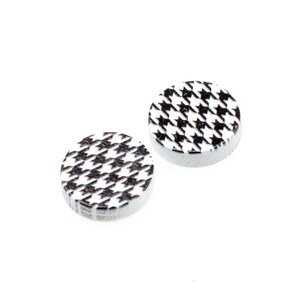 May include: Two round, white buttons with a black and white houndstooth pattern.