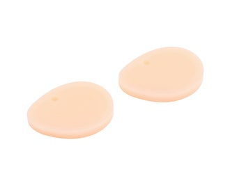 May include: Two light peach-colored silicone earplugs with a small hole in the center of each.