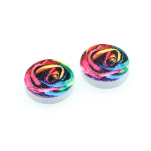 May include: Two round wooden earrings with a colorful rainbow rose print.