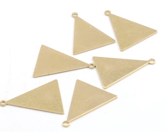May include: Six gold triangle-shaped metal charms with a loop at the top. The charms are flat and have a slightly textured surface.