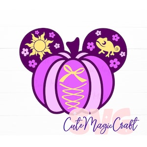 May include: A purple pumpkin-shaped design with mouse ears, featuring a yellow sun and chameleon. The pumpkin has a yellow bow and lacing detail. The text "Cute Magic Craft" is at the bottom.