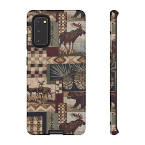 May include: A phone case with a tapestry design featuring forest animals like moose, deer, and bears. The case has a rectangular shape with a camera cutout and a patterned side. The color palette includes brown, green, and beige tones.