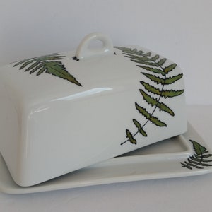Nice handpainted  fern design on a white ceramic butterdish.