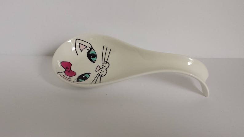 Handpainted girly cat face on porcelain spoon rest