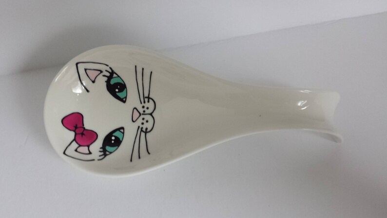 Handpainted girly cat face on porcelain spoon rest