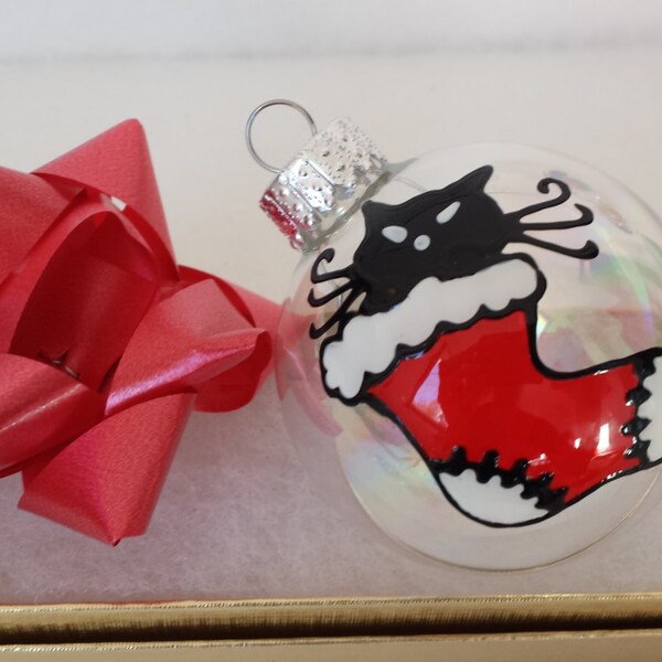 Handpainted ornament with a  funny black cat in a Christmas sock