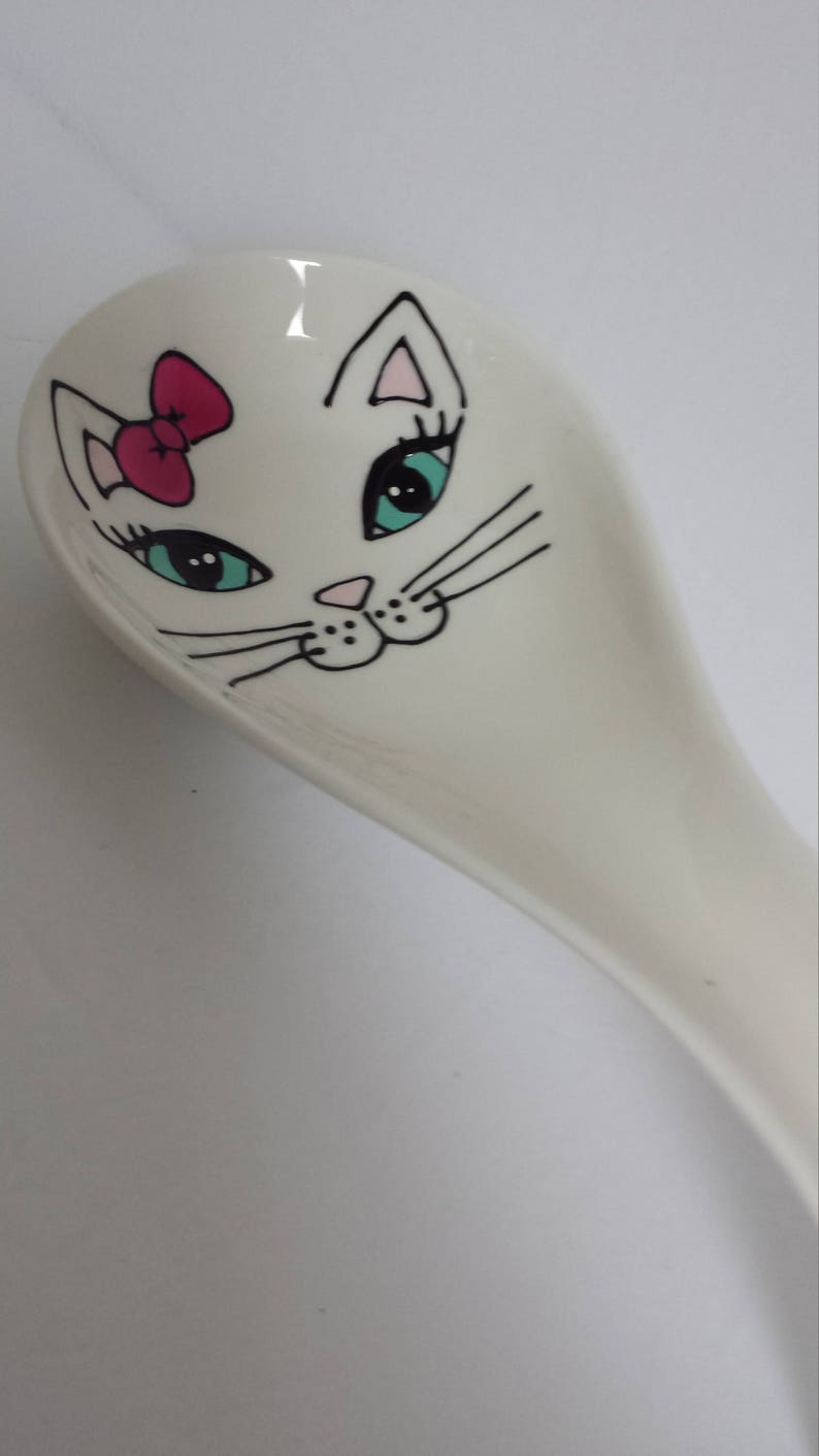 Handpainted girly cat face on porcelain spoon rest
