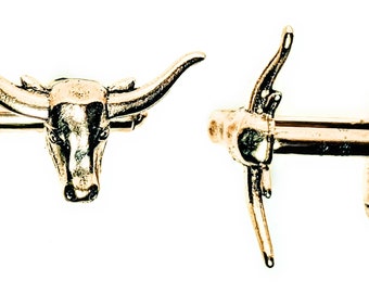 Gemelos de calavera de vaca dorada