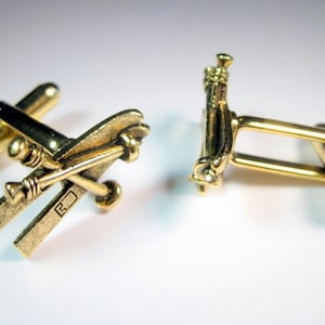 Gemelos de esquí dorados