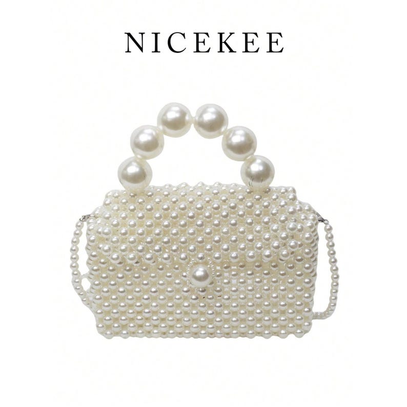May include: A white beaded handbag with a handle made of large pearls. The bag is rectangular with a pearl clasp and a pearl chain strap. The word "NICEKEE" is printed above the bag.