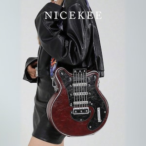 May include: A burgundy and black guitar-shaped crossbody bag with silver hardware. The bag has a guitar neck and strings design. The word "NICEKEE" is printed in white at the top. The bag is worn over the shoulder.