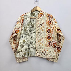 The reversible wearable design provides two unique styling options in one garment, making it a versatile addition to any wardrobe.