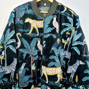 Handmade velvet kantha quilted bomber jacket with jungle animal and tropical foliage print, zip front design with ribbed collar and cuffs.