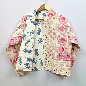 The reversible wearable design provides two unique styling options in one garment, making it a versatile addition to any wardrobe.