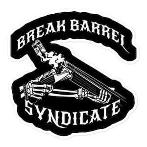 May include: Black and white sticker with the text "BREAK BARREL SYNDICATE". The design features a skeleton holding a double-barreled shotgun with smoke rising from the barrels. The sticker has a white border.