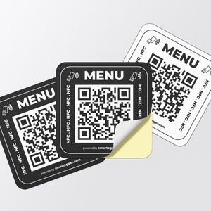 May include: Three square black and white stickers with rounded corners. Each sticker has the word "MENU" at the top, a QR code in the centre, and the text "NFC. NFC. NFC. NFC" along the sides. One sticker has a corner peeled back.