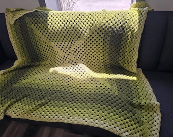Handmade, vintage Afghan blanket crafted using a green and yellow ombre granny square crochet pattern