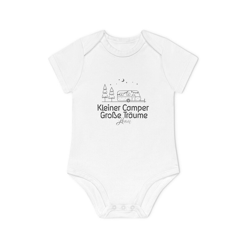 May include: White baby onesie with a black graphic of a camper, trees, and stars. The text "Kleiner Camper Gro&szlig;e Tr&auml;ume" is printed below the graphic. The onesie has short sleeves and snaps at the bottom.