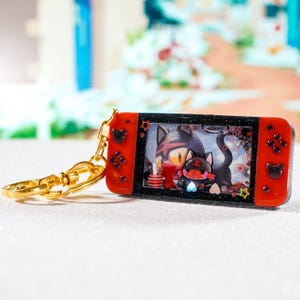 Porte clé SHAKER Switch Flamiaou fait main en Résine et fond carte Pokémon | Keychain resin art Litten