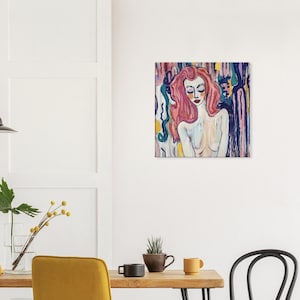May include: Square canvas art featuring a portrait of a woman with pink hair and closed eyes. The artwork uses a palette of pinks, blues, and yellows, with a background of vertical brushstrokes. The woman's skin is painted in soft, neutral tones.