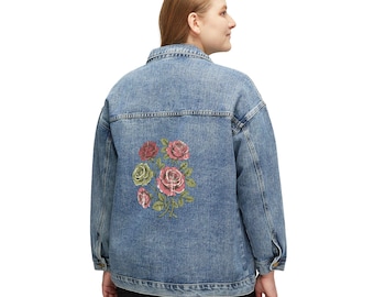 May include: A light blue denim jacket with a floral rose design on the back. The roses are in shades of red, pink, and green. The jacket has a classic button-up design with pockets and a collar.