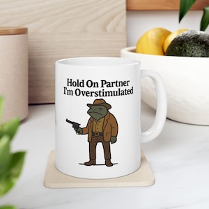 Funny Cowboy Frog Mug, Hold On Partner Im Overstimulated, Western Frog Meme Coffee Cup, Neurodivergent Humor Gift, Mental Health Cowboy Mug