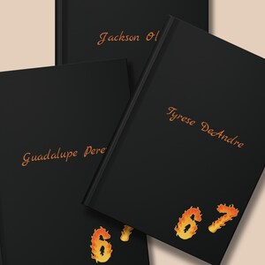 May include: Three black hardcover books with gold lettering. The names "Jackson Ol", "Tyrese DeAndre", and "Guadalupe Pere" are displayed on the covers. The number "67" is displayed in a flame design.