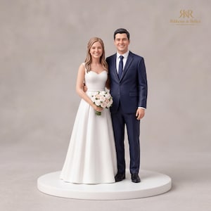 May include: A wedding cake topper figurine featuring a couple standing side by side on a circular base. The figure on the left wears a white sleeveless gown and holds a bouquet of pink and white roses. The figure on the right wears a navy blue suit.