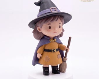 May include: A miniature figurine of a character wearing a black witch hat with a purple band, a purple cape, and a mustard yellow dress with patches. The character has brown hair, wears a black belt, and holds a brown broomstick in one hand.