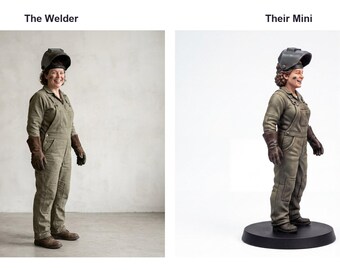 May include: A side-by-side comparison showing a person dressed in olive green overalls, brown leather gloves, and a black welding helmet, alongside a miniature figurine replica of the same person wearing identical gear on a black base.