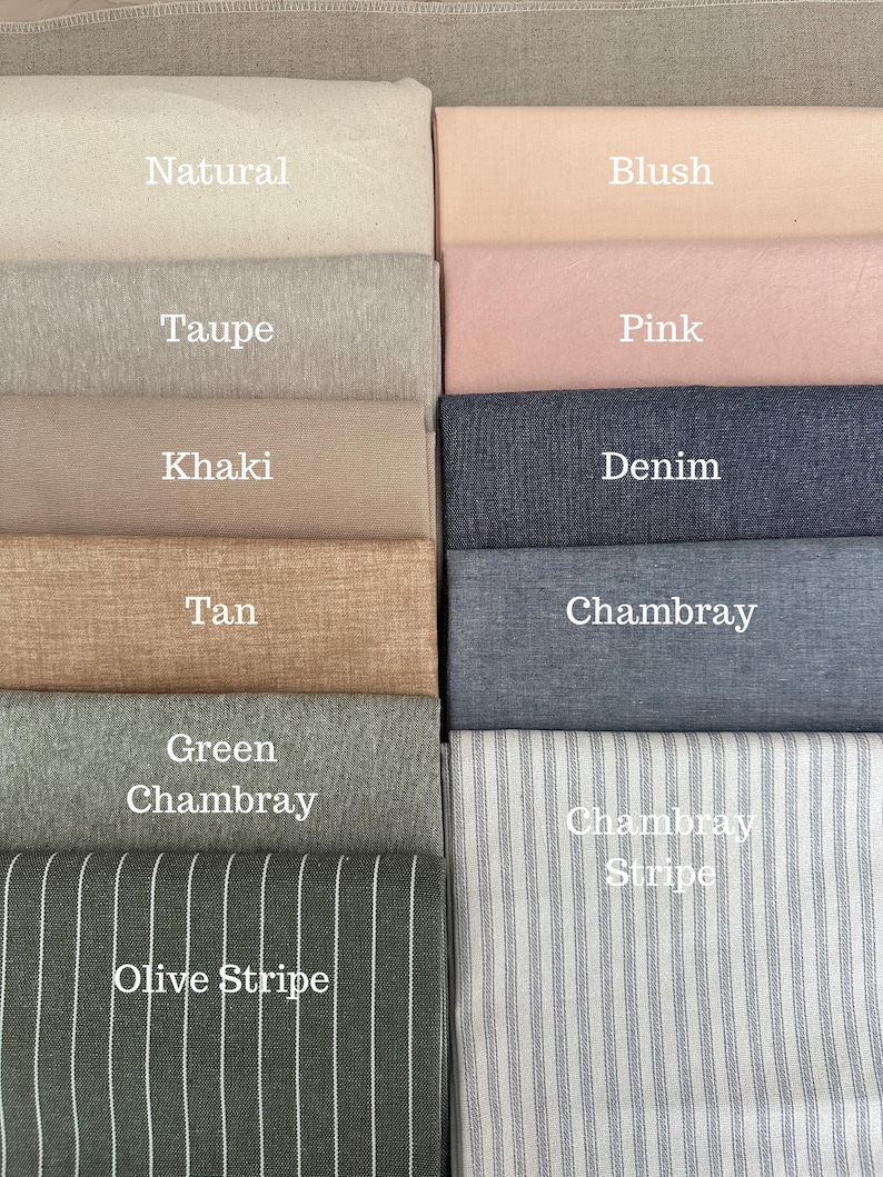 May include: A collection of fabric swatches in various colors, including natural, taupe, khaki, blush, pink, denim, tan, chambray, green chambray, olive stripe, and chambray stripe. Each swatch is labeled with its color name in white text.