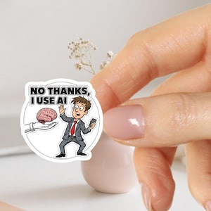 Könnte beinhalten: Runder Aufkleber mit dem Text "NO THANKS, I USE AI". Er zeigt eine Cartoon-Illustration eines Mannes im Anzug, der ein Gehirn ablehnt. Der Mann hält ein Telefon, und das Gehirn ist rosa. Der Hintergrund ist weiß.
