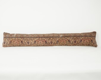May include: A long, rectangular pillow with a detailed floral pattern in shades of beige, brown, and red. The pillow's design features a repeating motif of flowers and leaves, creating a vintage or antique aesthetic. The pillow is likely used for decorative purposes.