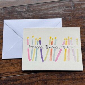 Cartão de aniversário com vela de aquarela feita à mão